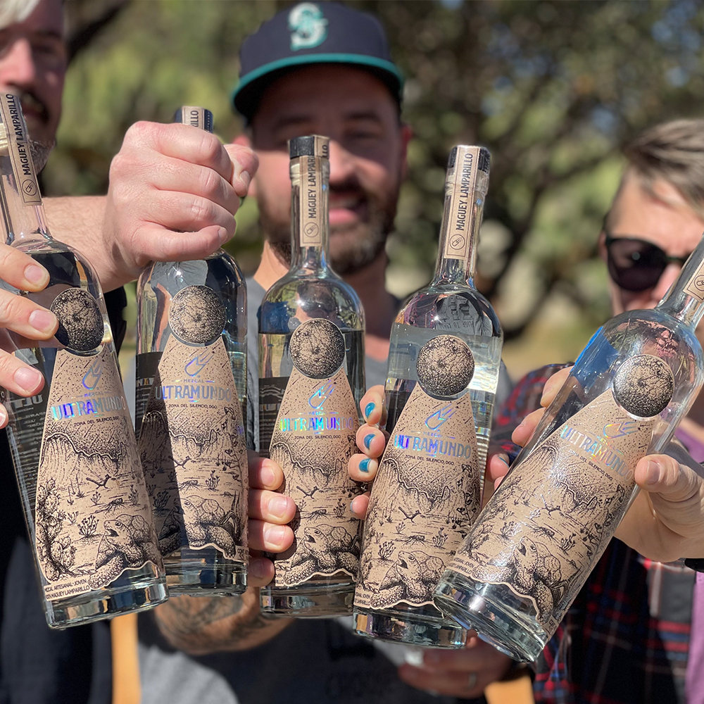 group of people holding liquor bottles